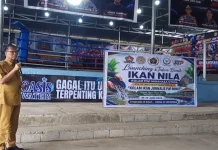 Tebar Benih Ikan Nila Program PWI Minut
