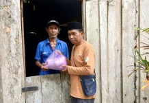 Baznas Touna Distribusikan Zakat Fitrah kepada Mustahik
