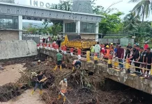 Penanganan Banjir Pasca Hujan di PLBN Motaain telah dilakukan