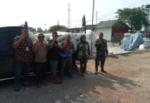 Babinsa Koramil Binong Bantu Petani dalam Program Serap Gabah