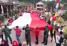 Kirab Bendera Raksasa Warnai Syukuran Perbaikan Jalan di Cimanggu Pandeglang