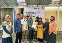 Bulog Bukittinggi Salurkan Bantuan Pangan, Ribuan Warga Tersenyum