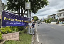 Jasa Raharja dan Polresta Bukittinggi Pasang Baliho Peringatan Rawan Lakalantas