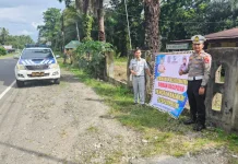 Jasa Raharja Pasang Spanduk Himbauan di Pasaman Barat