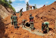 Satgas TMMD Ke-129 Kodim 0306/50 Kota Kebut Pemasangan Talud Penahan Jalan