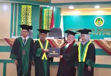 Doktor Pertama! Sry Eka Handayani Harumkan Pendidikan Bukittinggi Gemilang