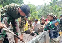 Pembangunan Jalan Terus Dikebut, Satgas TMMD ke-129 Bongkar Material di Titik 1.900
