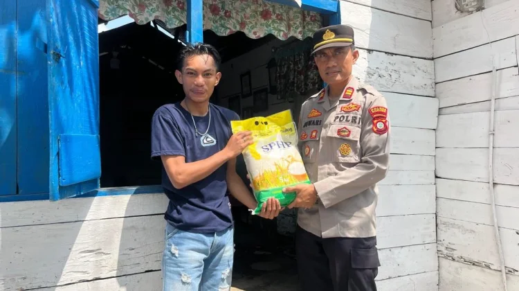 Polsek Paguyaman Salurkan Bantuan Beras ke Warga Pelosok Paguyaman