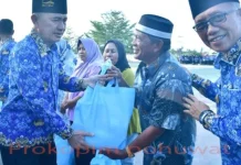 Korpri Pohuwato Salurkan 60 Paket Sembako untuk Cleaning Service