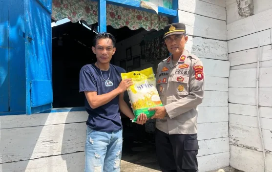 Polsek Paguyaman Salurkan Bantuan Beras ke Warga Pelosok Paguyaman