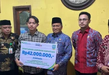 Ahli Waris Ketua RT Terima Santunan JKM BPJS Ketenagakerjaan