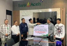 PT Bank Aceh Syariah Cabang Lhokseumawe Menyerahkan Zakat Kepada BMK Lhokseumawe