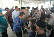 Kapolres Lhokseumawe Hadiri Khanduri Waduk Pusong dan Santuni Anak Yatim