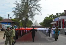 Kirab Bendera Merah Putih 81 Meter Kobarkan Semangat Kemerdekaan di Kota Langsa