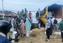 Polres Lhokseumawe Kawal Penyaluran Beras Bantuan Pangan di Muara Dua