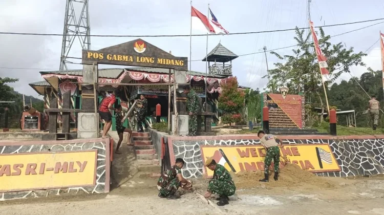 Satgas Pamtas Yonarmed 4/Parahyangan Bangun Gapura Pos Gabma Long Midang