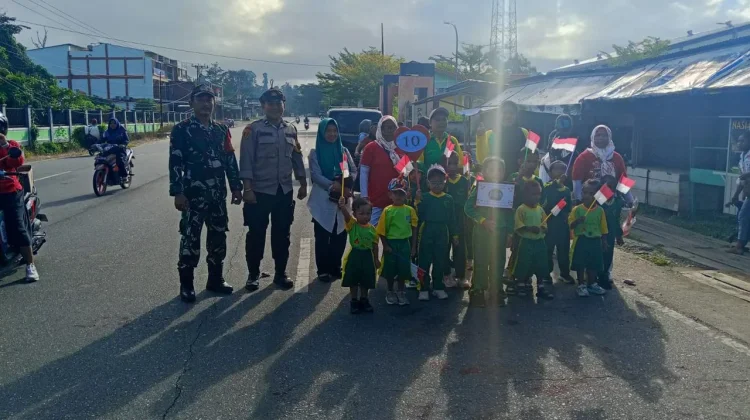 Sinergi TNI Polri Amankan Jalan Santai Siswa Manimeri