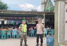Babinsa dan Bhabinkamtibmas Laksanakan Pengamanan Kegiatan Ibadah