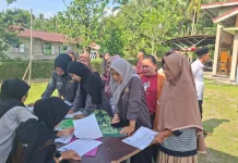 KKN Sebauk UNRI dan Bulog Bengkalis Gelar Bazar Pangan Murah