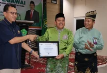Muliardi Terima Dua Penghargaan dari Kanwil DJPb Riau, Disaksikan Sekjen Kemenag
