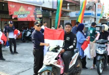 Sambut HUT RI ke-81, Bupati Asmar Bagikan 1.000 Bendera Merah Putih