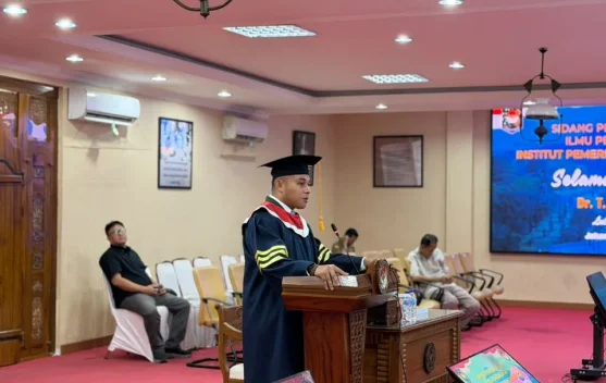 Camat Marpoyan Damai Raih Gelar Doktor IPDN dengan Predikat Sangat Memuaskan