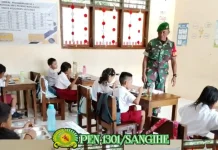 Babinsa Manganitu Kawal Program Makan Bergizi bagi Siswa