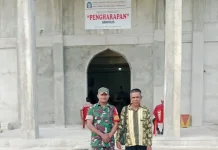 Babinsa Koramil Nanusa Amankan Ibadah Minggu Jemaat Dampulis