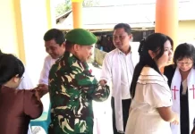 Babinsa Ikut Beribadah Sekaligus Jaga Keamanan