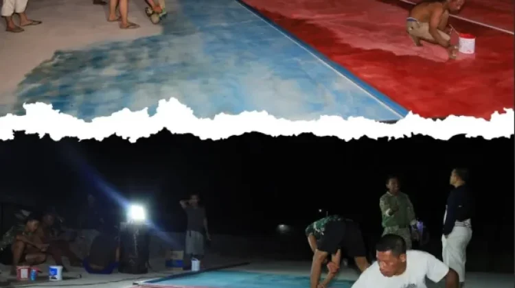 Satgas TMMD ke-129 Bersama Warga Tuntaskan Finishing Lapangan Voli hingga Malam