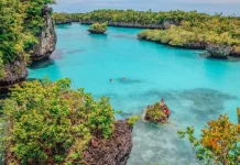 Bair Island Showcases Turquoise Waters and Coral Cliffs in Maluku